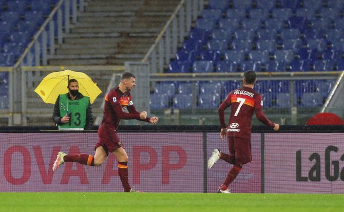 Roma's Edin Dzeko (left) celebrates with teammate with Lorenzo Pellegrini after scoring their side's first goal during their Serie A match against UC Sampdoria at Stadio Olimpico in Rome on Sunday