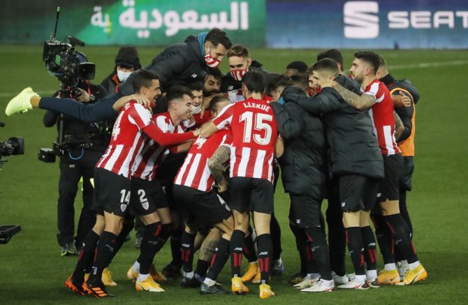  Athletic Bilbao players celebrate at the end of the match.