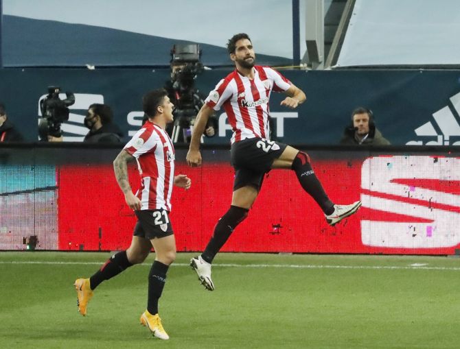 Raul Garcia celebrates scoring Athletic Bilbao's second goal with Ander Capa during the Spanish Super Cup semi-final against Real Madrid on Thursday.