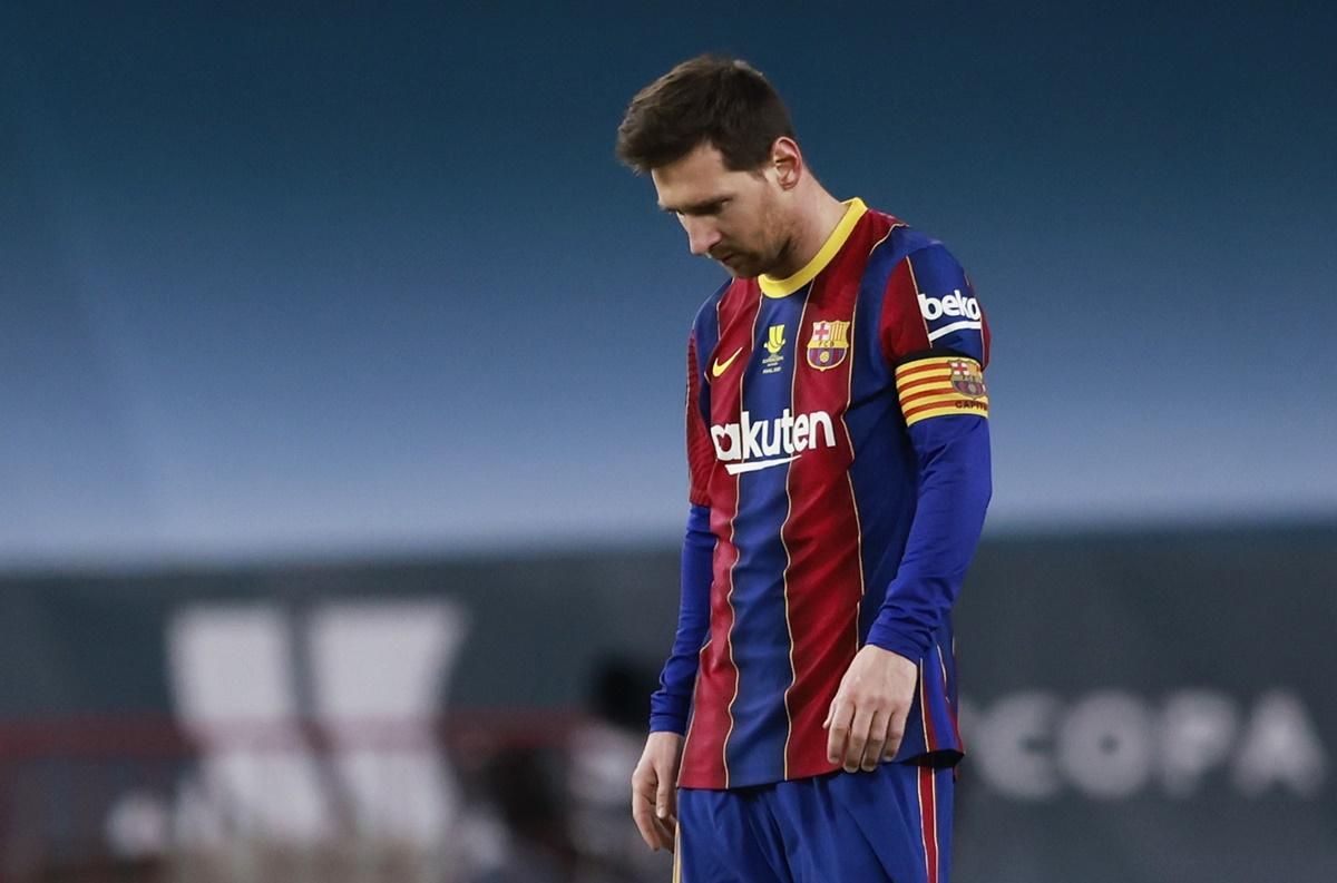 Barcelona's Lionel Messi walks off the ground after being shown the red card in the final of the Spanish Super Cup against Athletic Bilbao on Sunday. 