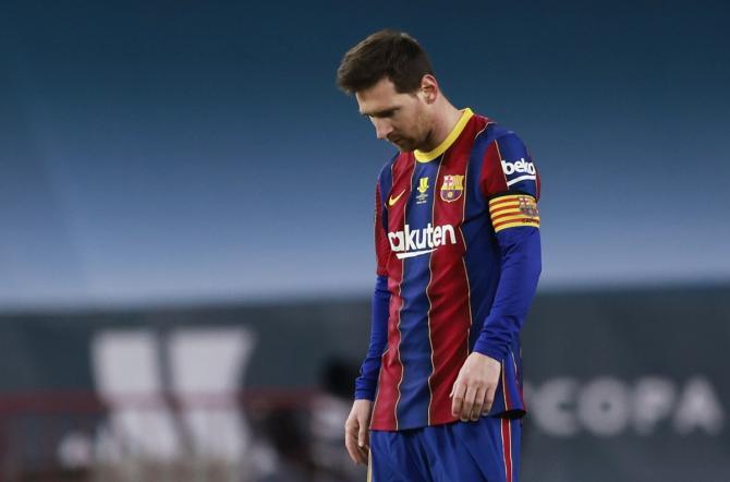 Barcelona's Lionel Messi walks off the ground after being shown the red card in the final of the Spanish Super Cup against Athletic Bilbao on Sunday. 