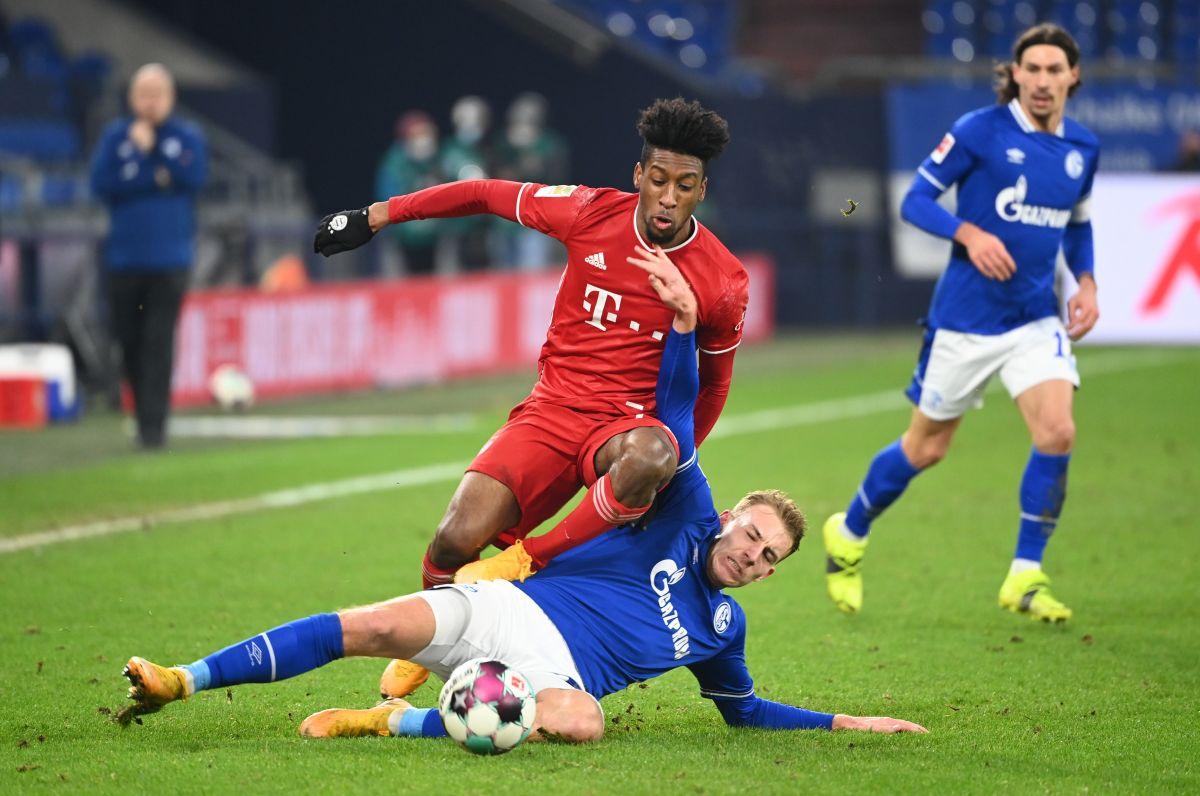 Bayern Munich's Kingsley Coman in action with Schalke 04's Timo Becker during their Bundesliga match at Veltins-Arena, Gelsenkirchen, Germany 