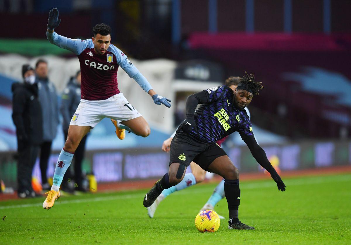 Newcastle United's Allan Saint-Maximin in action with Aston Villa's Trezeguet during their Premier League match at Villa Park in Birmingham on Saturday 