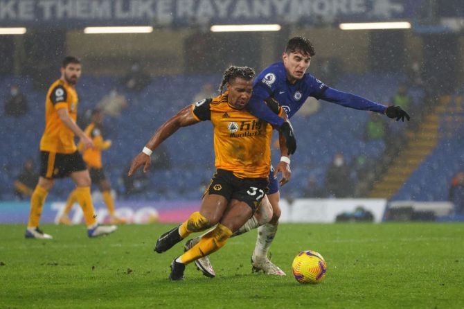 Wolverhampton Wanderers' Adama Traore is tackled by Chelsea's Kai Havertz during their Premier League match at Stamford Bridge in London on Wednesday