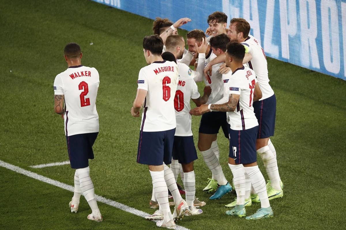 Jordan Henderson celebrates with teammates Luke Shaw, John Stones and Harry Kane after scoring England's fourth goal during the Euro 2020 quarter-final against Ukraine, at Olimpico stadium in Rome, Italy, on Saturday. 