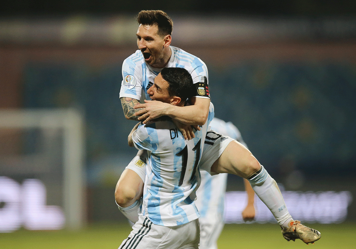 Argentina's Lionel Messi celebrates scoring their third goal with Angel Di Maria 
