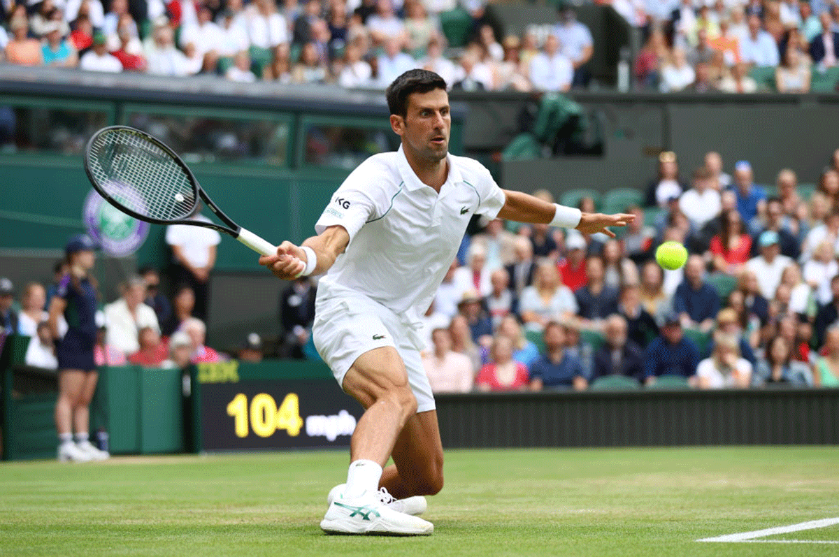 Serbia's Novak Djokovic stretches to play a forehand in his fourth round match against Chile's Cristian Garin