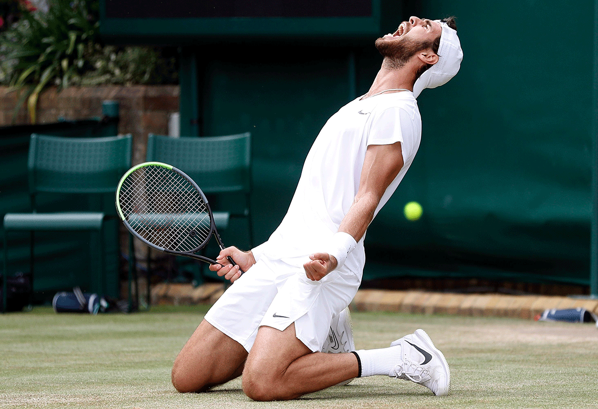 Russia's Karen Khachanov celebrates winning his fourth round match against American Sebastian Korda