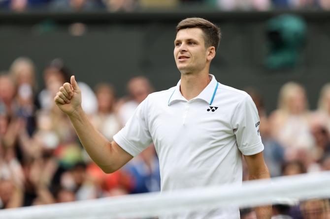 Poland's Hubert Hurkacz celebrates victory over Russia's Daniil Medvedev during Day 8 of The Championships - Wimbledon 2021