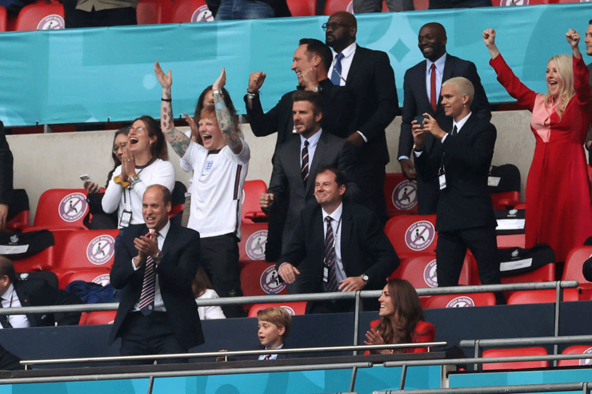 Singer Ed Sheeran, former England captain David Beckham, Romeo Beckham and Prince William, President of the Football Association, Prince George and Duchess Catherice celebrate in the stands