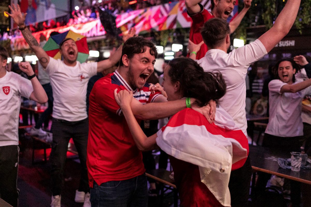  England fans cheer at BOXPARK Croydon as they watch a live broadcast of the semi-final match between England and Denmark