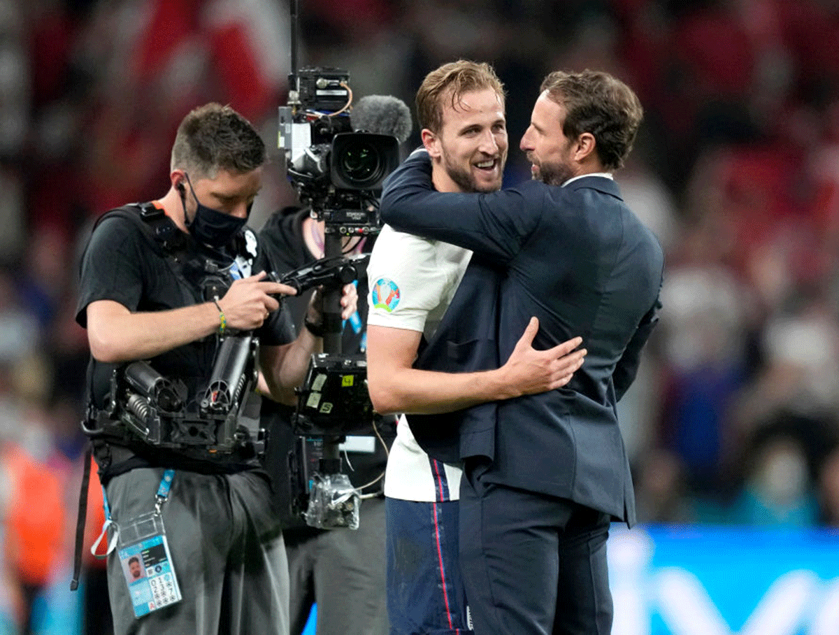 England captain Harry Kane and coach Gareth Southgate celebrate following their team's victory