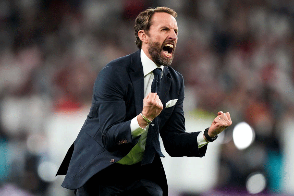 England coach Gareth Southgate celebrates after his team defeated Demark in the UEFA Euro 2020 Championship semi-final at Wembley Stadium in London on Wednesday