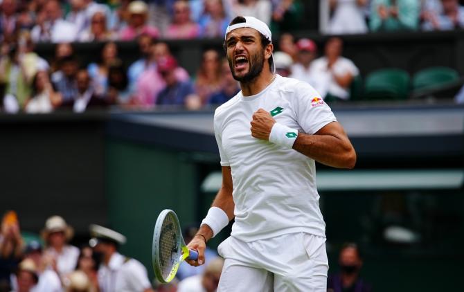 Italy's Matteo Berrettini celebrates victory Poland's Hubert Hurkacz in the men's singles semi-finals of The Championships - Wimbledon 2021