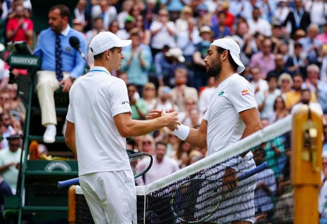 Matteo Berrettini and Hubert Hurkacz shake hands at the net after their semi-final