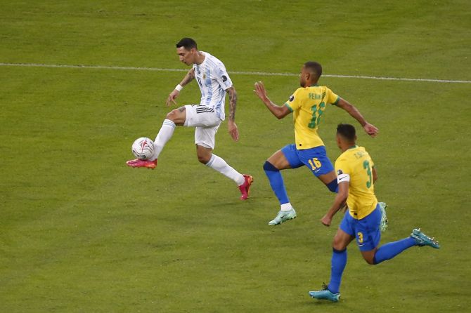 Angel Di Maria fires the ball on target to score.