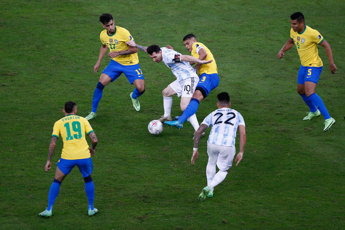 Argentina's Lionel Messi fights for the ball with Brazil's Thiago Silva during the Copa America final at Maracana Stadium in Rio de Janeiro on Saturday, July 10.