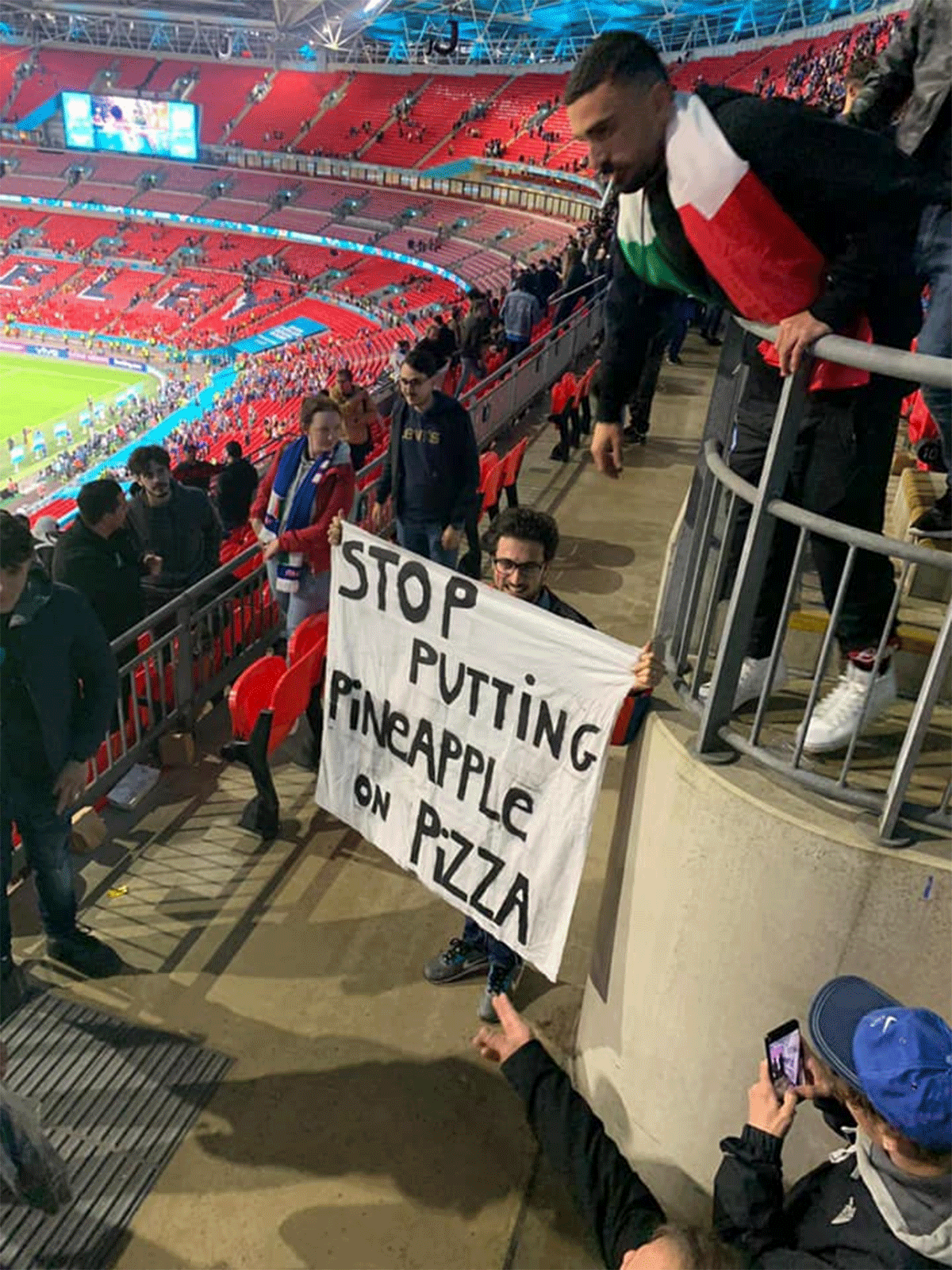 A banner against Hawaiian pizza