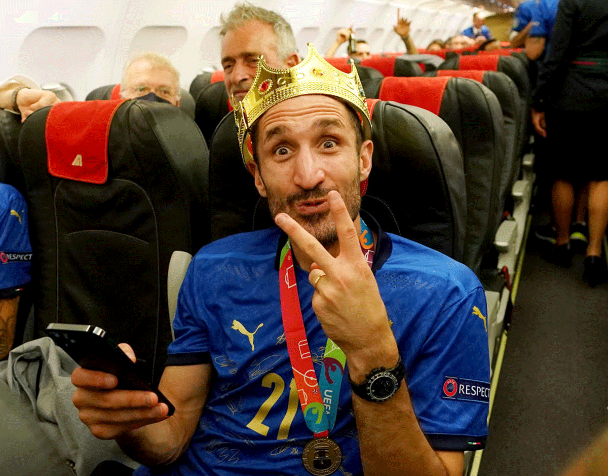 Italy captain Giorgio Chiellini on the plane during the travel back to Rome on Monday.
