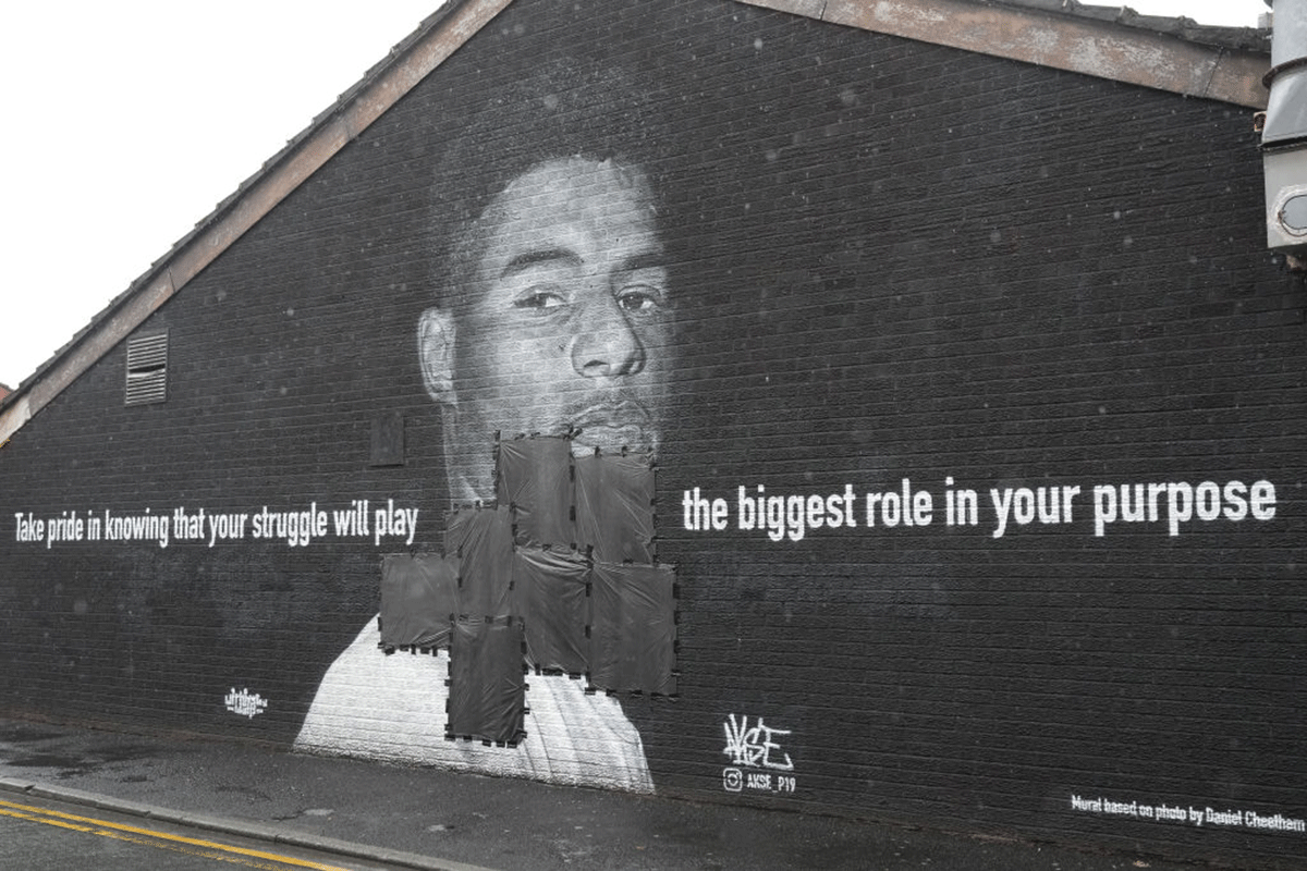 Bin bags cover offensive graffiti on the vandalised mural of Manchester United and England striker Marcus Rashford on the wall of a cafe on Copson Street, Withington on Monday. Rashford and other Black players on England's national football team have been the target of racist abuse, largely on social media, after the team's loss to Italy in the UEFA European Football Championship on Sunday. 