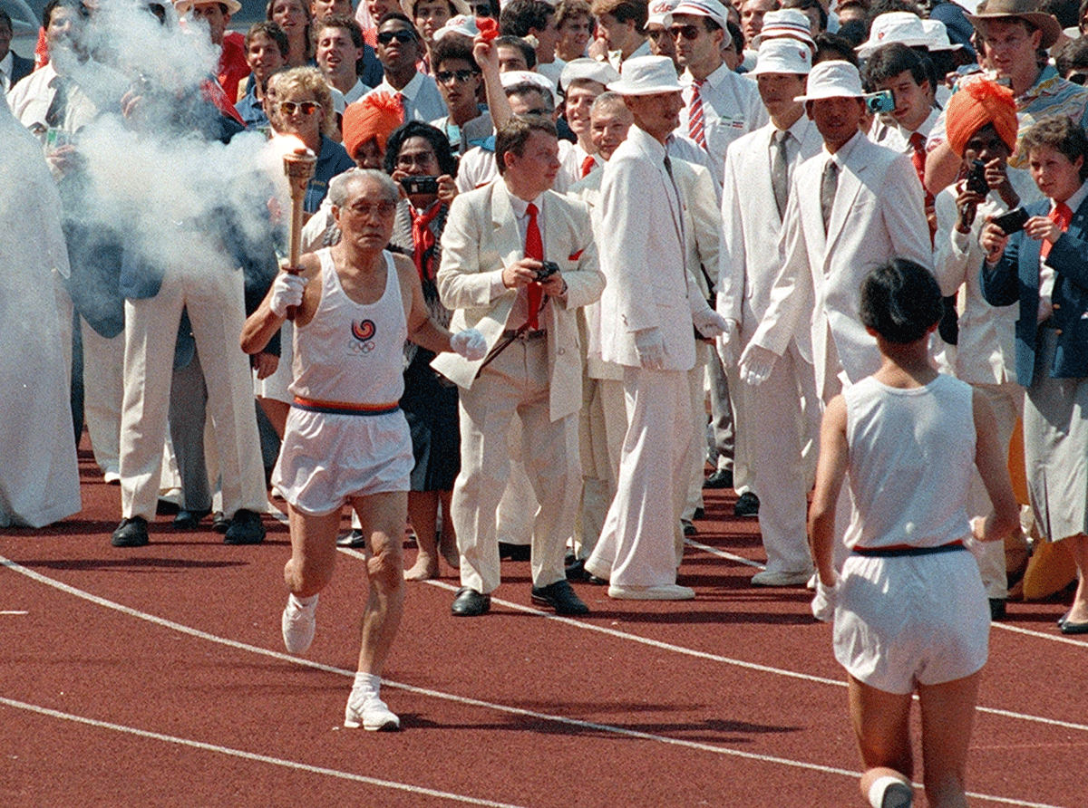 Sohn Kee-chung carries a torch in the opening ceremony of 1988 Seoul Olympic Games in Seoul, South Korea