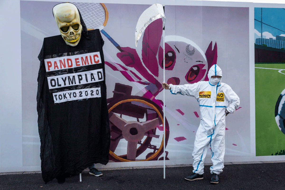 Protesters demonstrate against the forthcoming Tokyo Olympic Games in Tokyo on Friday