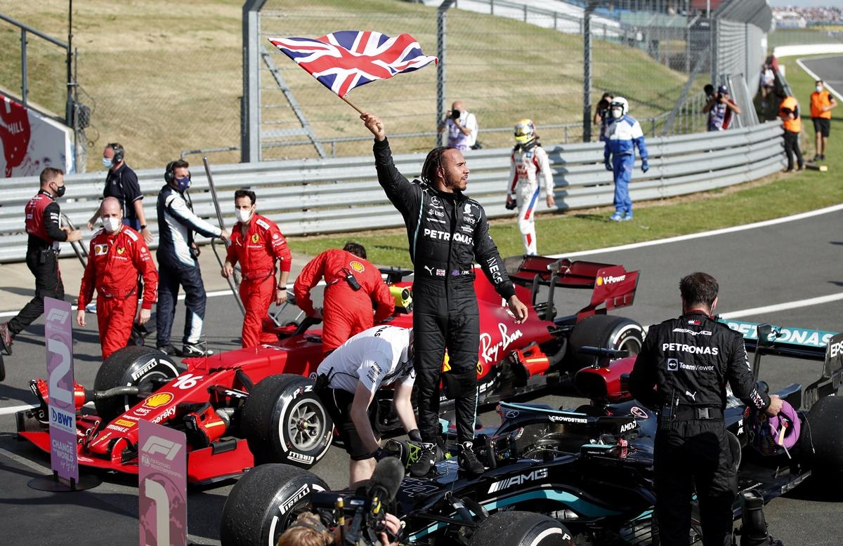 Mercedes driver Lewis Hamilton celebrates after winning the British Grand Prix, at Silverstone Circuit, in Britain, on Sunday.