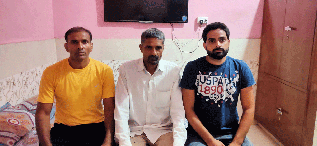 Ravi Dahiya's father, Rakesh Kumar Dahiya (centre) with family members