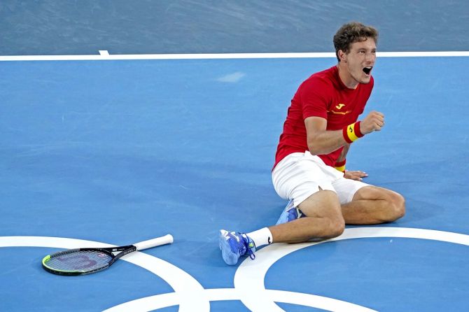 Spain's Pablo Carreno Busta celebrates beating Serbia's Novak Djokovic in the Olympics men's tennis bronze medal match, at Ariake Tennis Park, in Tokyo, on Saturday.