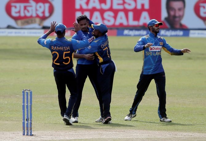 Dushmantha Chameera is congratulated by his Sri Lanka teammates after dismissing Shikhar Dhawan.  
