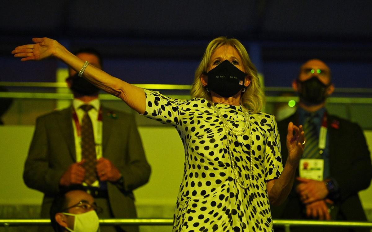 The United States’ First Lady Jill Biden waves to athletes during the opening ceremony parade of athletes