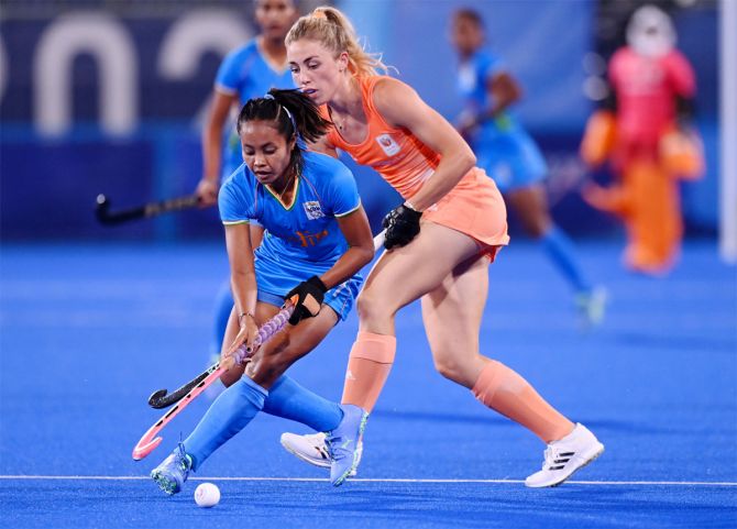 India's Sushila Chanu Pukhrambam battles for possession during the Tokyo Olympics women's hockey match against the Netherlands on Saturday.