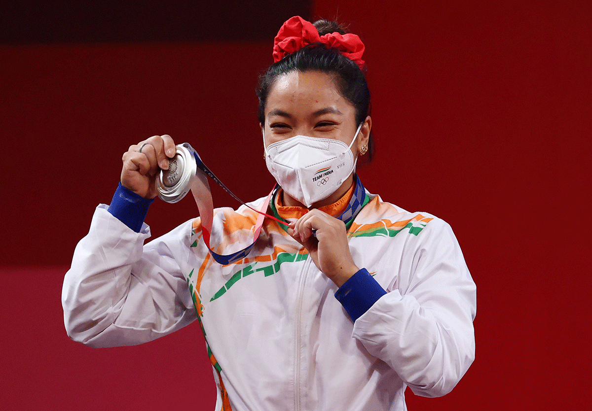 India's Mirabai Chanu Saikhom on the podium after winning a silver medal in weightlifting at the Tokyo Olympics on Saturday