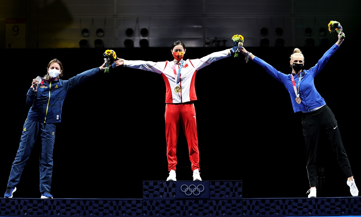 Silver medalist Ana Maria Popescu of Romania, gold medalist Yiwen Sun of China and bronze medalist Katrina Lehis of Estonia pose on the podium during the women’s Epee Individual medal ceremony