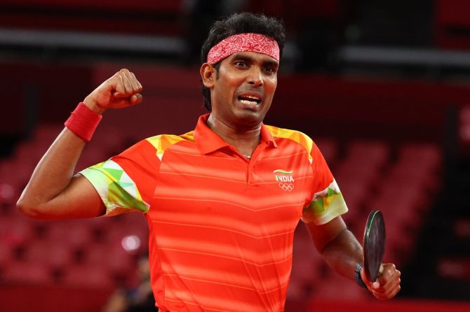 India's Achanta Sharath Kamal reacts after winning his men's singles Round 2 table tennis match against Portugal's Tiago Apolonia at the Tokyo Games on Monday