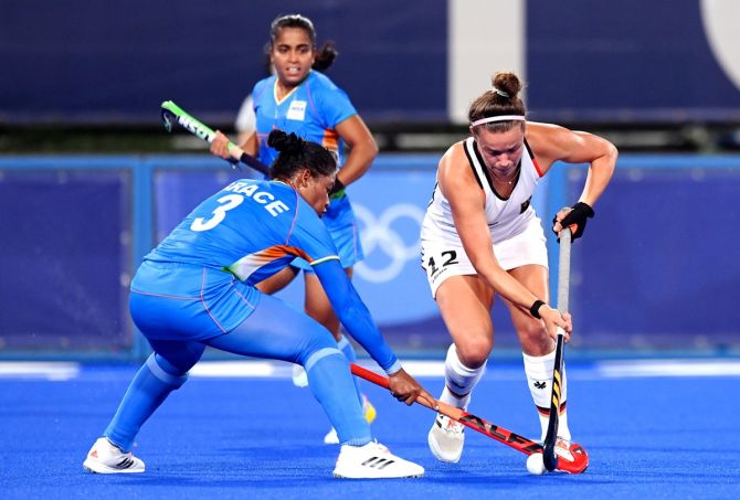 India defender Deep Grace makes a vain bid to stop Germany's Charlotte Stapenhorst during the women's Group A match at the Tokyo Olympics on Monday. 
