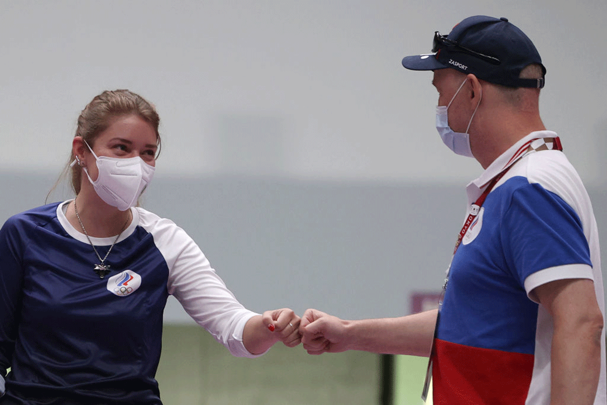 Olympic Record holder Vitalina Batsarashkina of Team ROC celebrates with her coach following the 10m Air Pistol Women's event on day two of the Tokyo 2020 Olympic Games at Asaka Shooting Range on in Asaka, Saitama, Japan, on Sunday