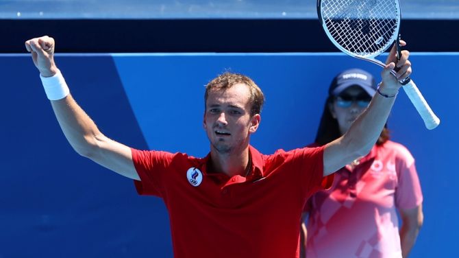 Daniil Medvedev of the Russian Olympic Committee celebrates after winning his third round match against Italy's Fabio Fognini