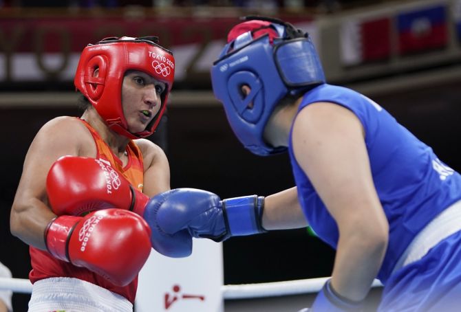 India's Pooja Rani in action against Algeria's Ichrak Chaib during the women's 75kg Olympics boxing bout, at Kokugikan Arena in Tokyo, on Wednesday