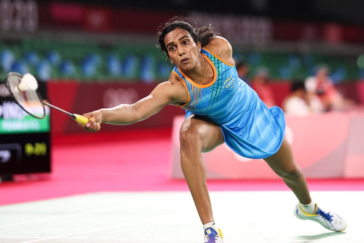 India's Pusarla V. Sindhu reaches for a drop shot from Hong Kong's Cheung Ngan Yi during their women’s singles Group J match at the Tokyo Olympics on Wednesday.