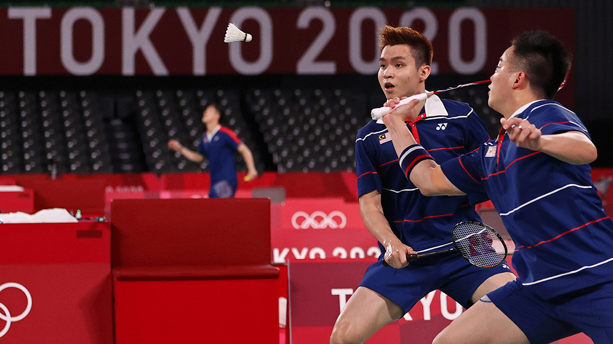 Malaysia's Aaron Chia and Soh Wooi Yik in action during their match against Indonesia's Marcus Fernaldi Gideon and Kevin Sanjaya Sukamuljo in the badminton men's doubles quarter-finals at the Tokyo Olympics on Thursday