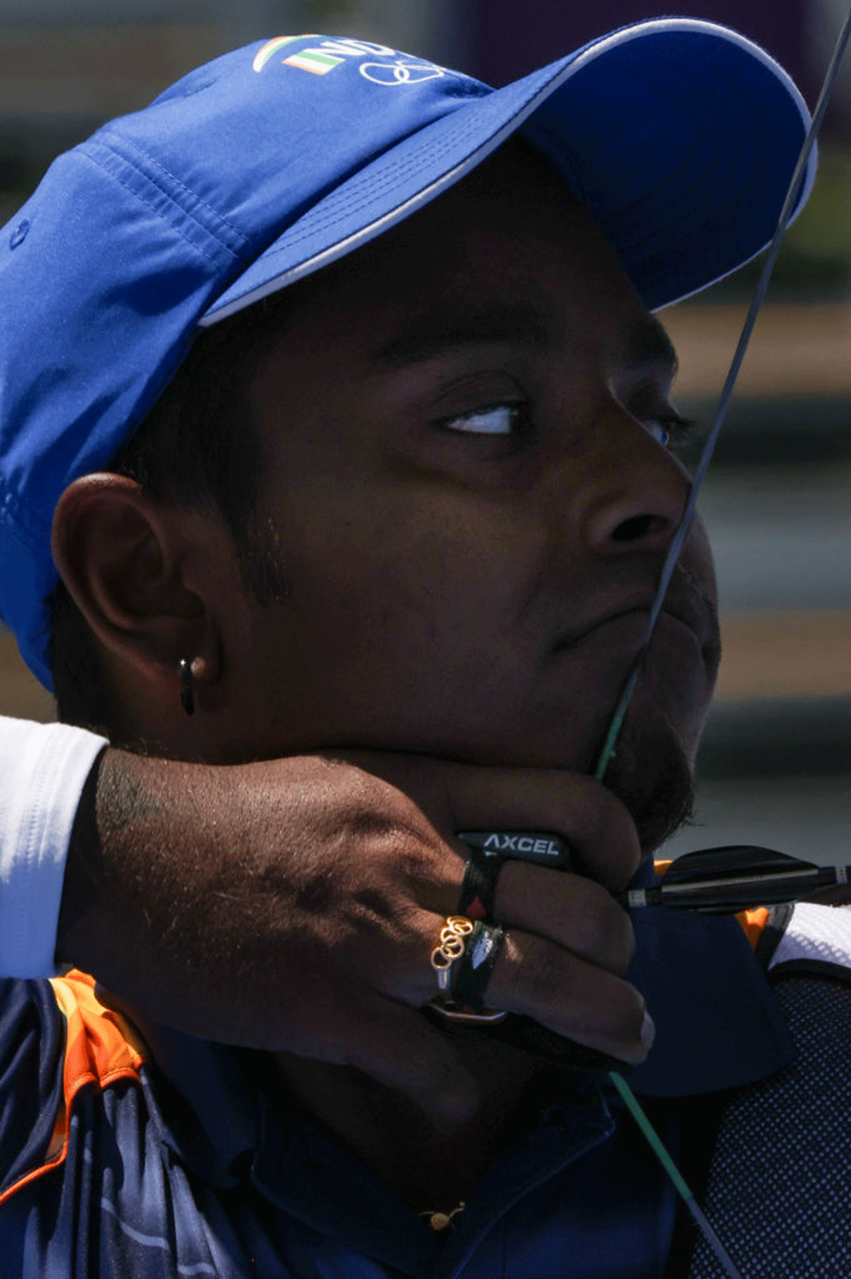 Atanu Das sports an Olympic ring while he competes during the archery Men's Individual Eliminations on Thursday