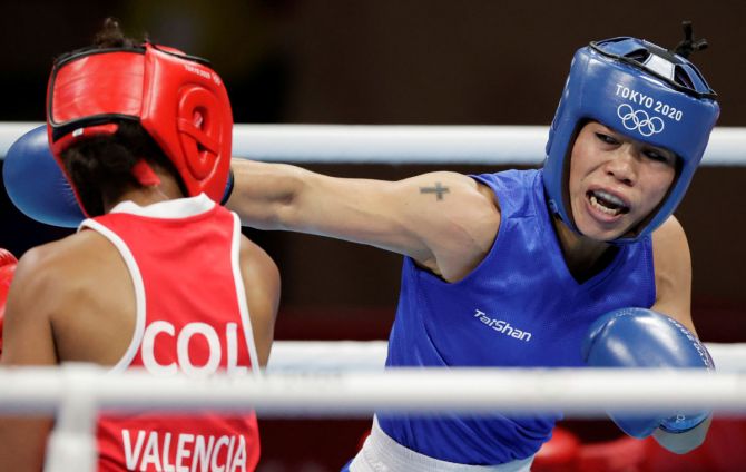 M C Mary Kom trades a right punch on Ingrit Valencia's face