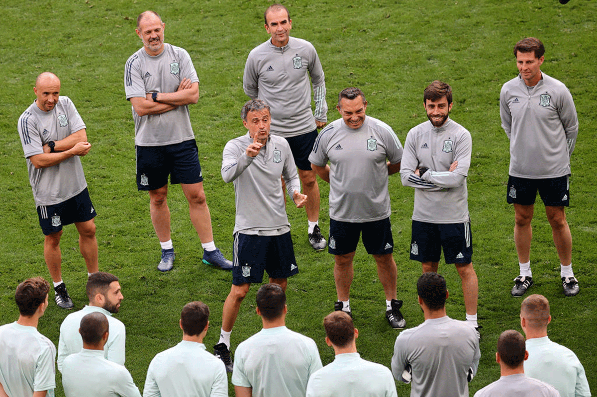 Spain's coach Luis Enrique speaks to his players during a team training session
