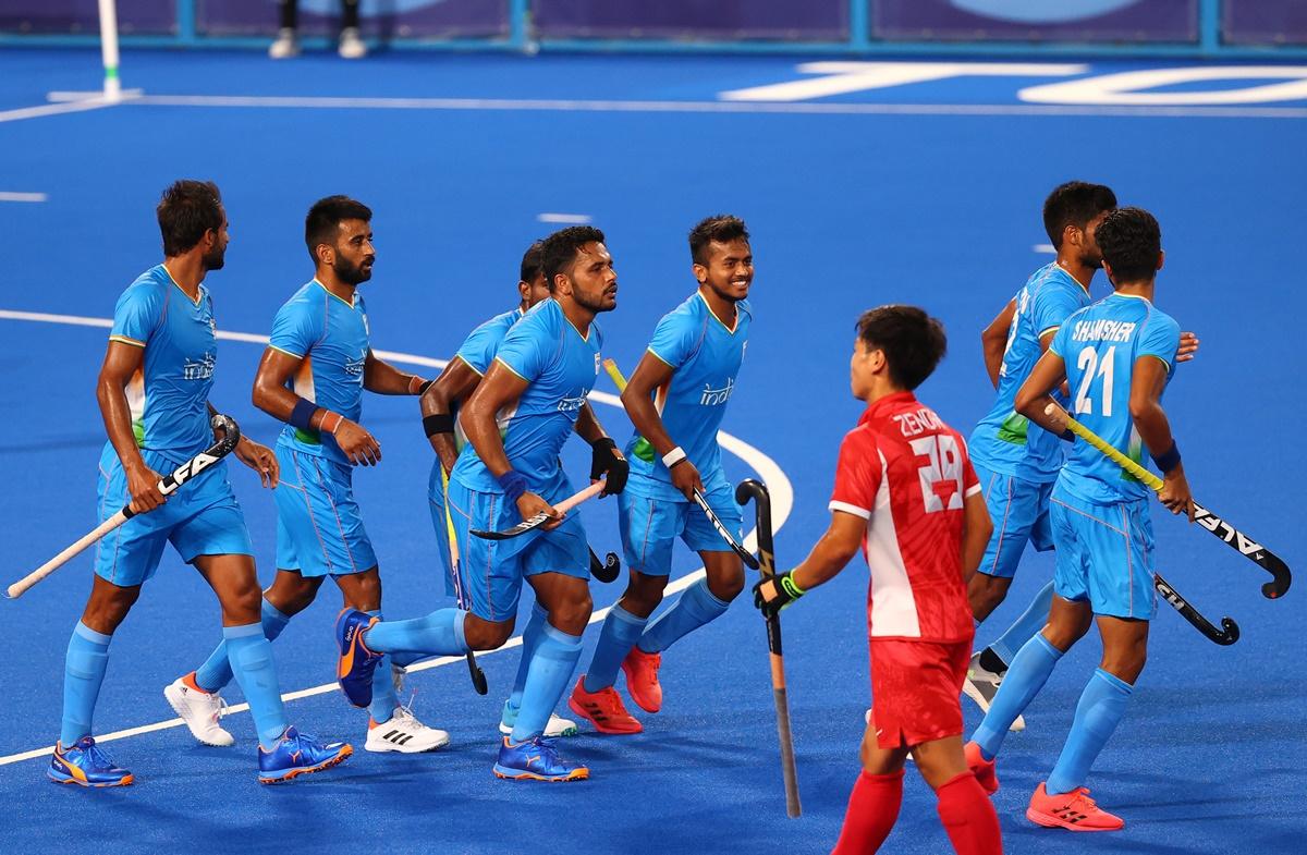 Harmanpreet Singh celebrates with teammates after putting India ahead in the men's Olympics hockey match against Japan on Friday. 