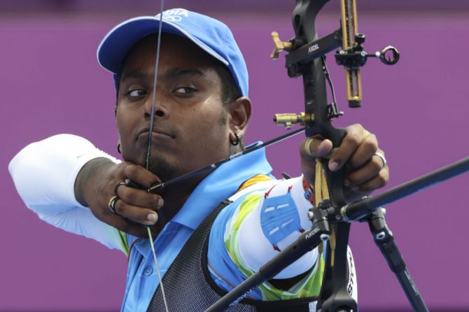 India's Atanu Das competes in the Olympics archery men's individual 1/8 eliminations, at Yumenoshima Park Archery Field, in Tokyo, on Saturday