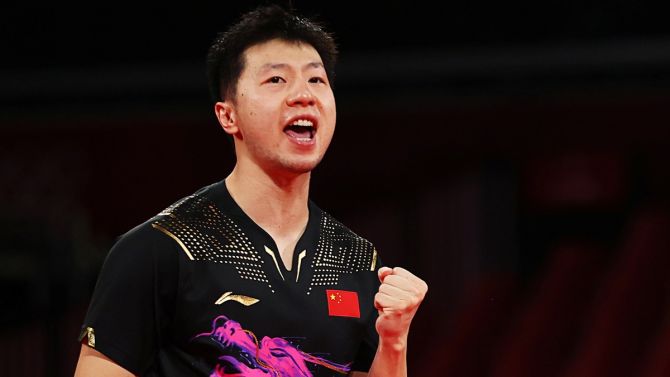 China's Ma Long of China reacts during the Olympics men's singles final against compatriot Fan Zhendong, at Tokyo Metropolitan Gymnasium