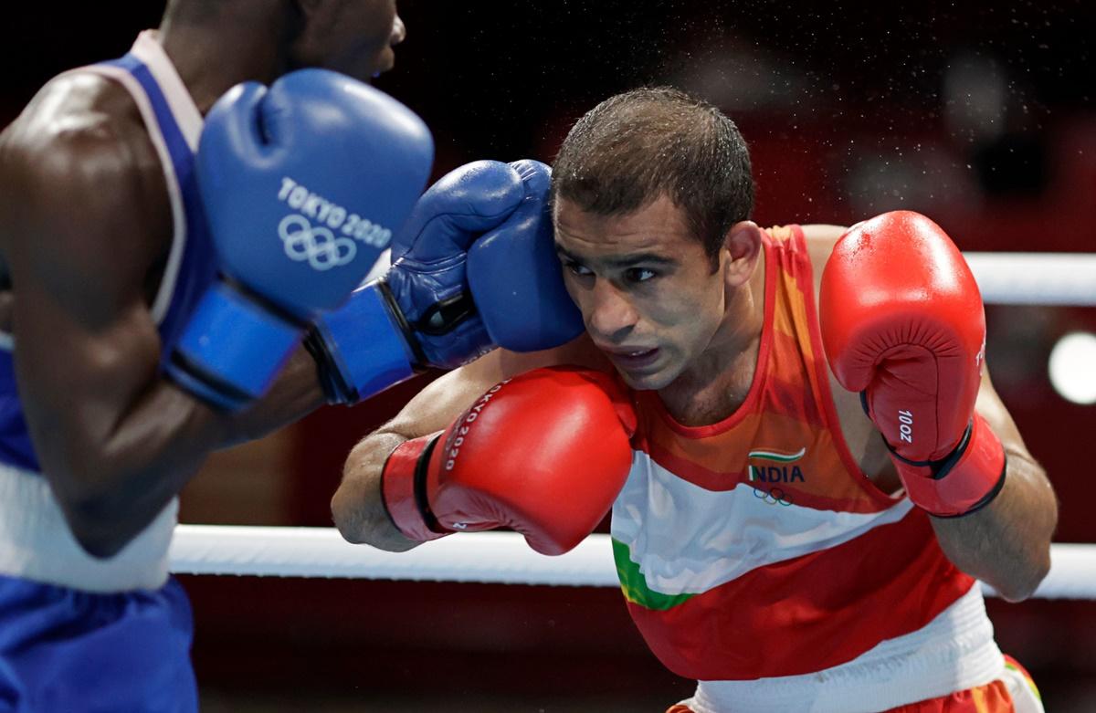 India's Amit Panghal in action against Colombia's Yuberjen Martinez Rivas in the Olympics boxing men's flyweight last 16 bout