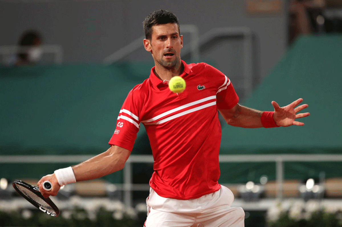 Serbia's Novak Djokovic plays a forehand in his first round match against USA's Tennys Sandgren