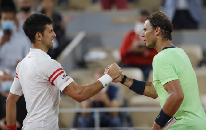 Novak Djokovic and Rafael Nadal meet at the net after their semi-final match